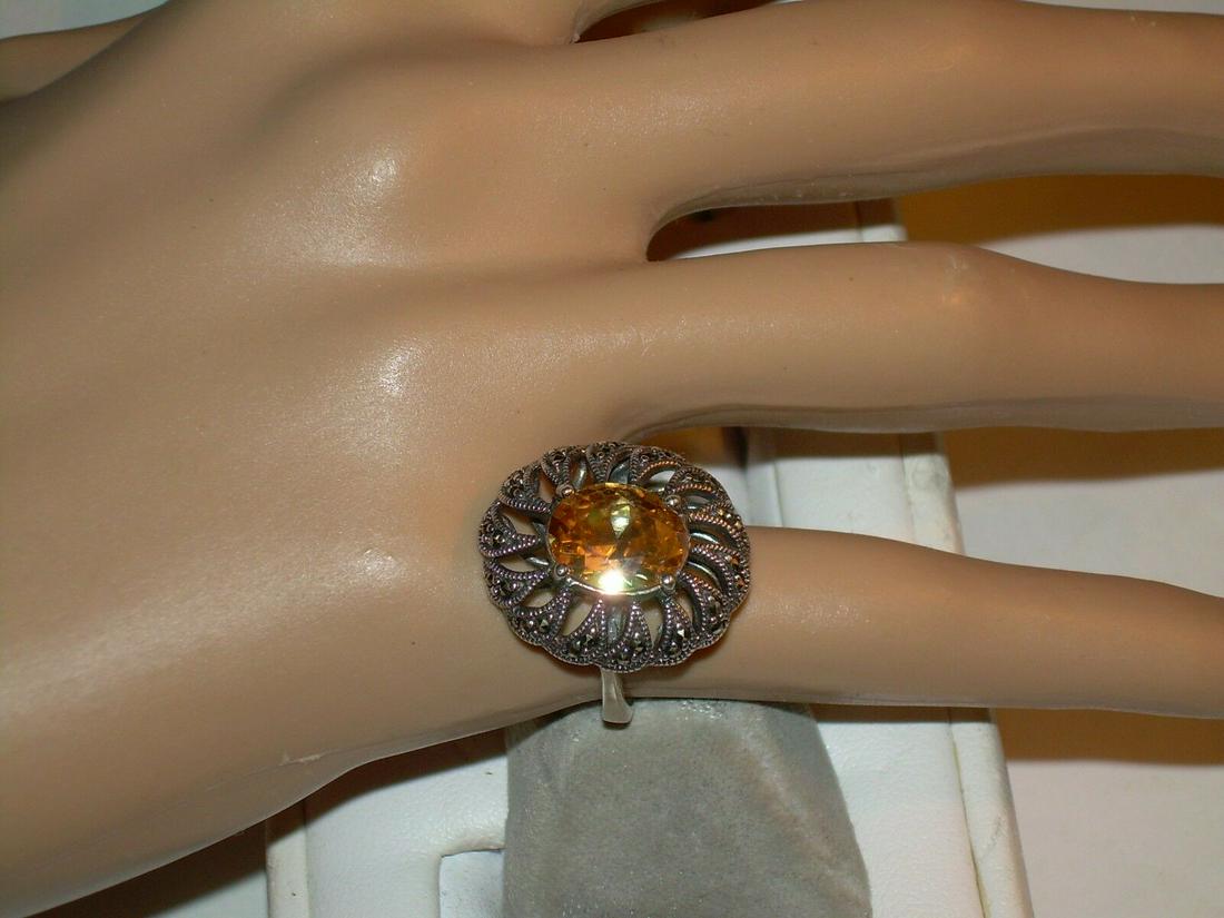 Sterling Silver Topaz Marcasite Ring - Size 5.5 -: Vintage sterling silver ring is an open weave which is accented in marcasite. The ring has a large oval shaped Topaz stone raised in the center in a prong setting. The band of the ring is solid. It is