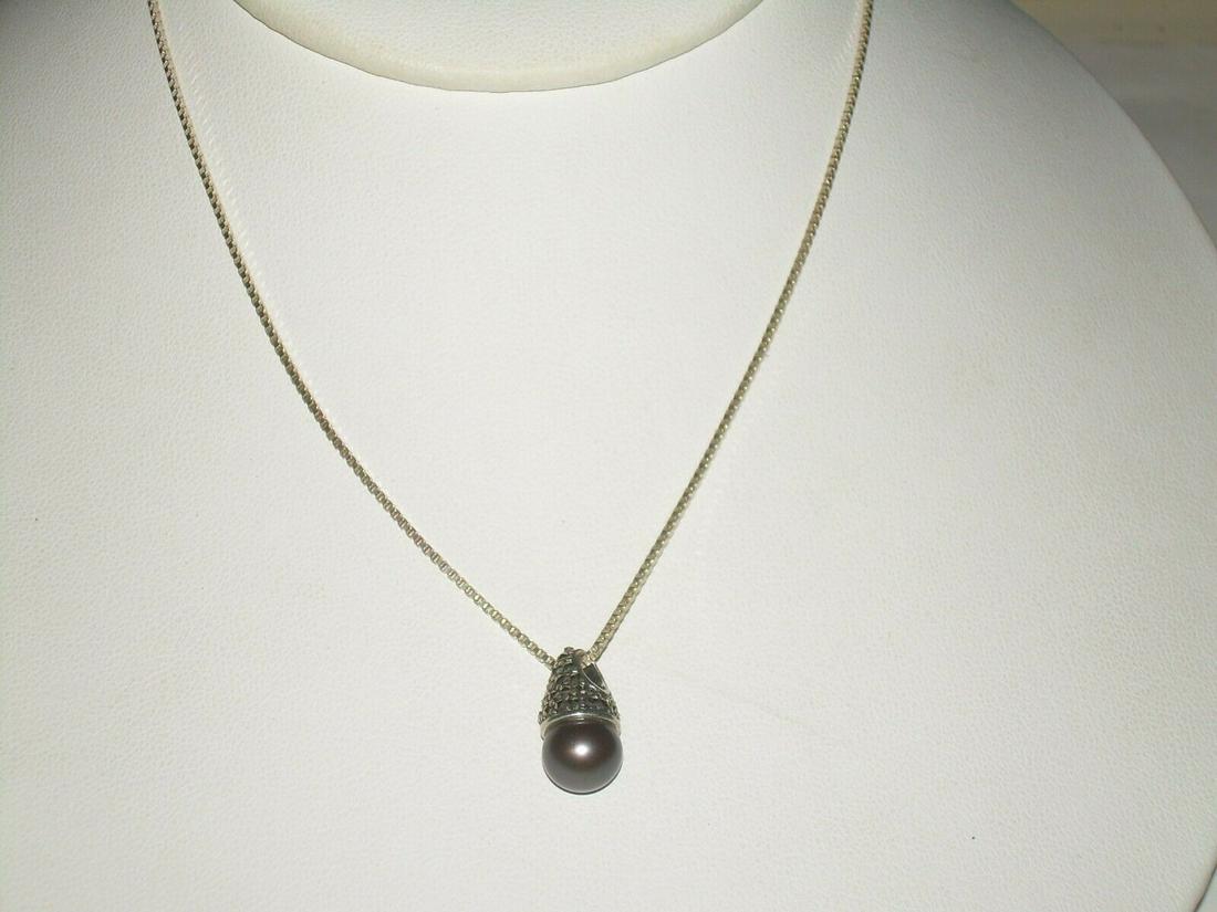 Sterling Gray Tahitian Pearl Necklace/Penda; nt - In A: Vintage sterling silver Tahitian Gray Pearl necklace/pendant is 16" in length. The chain is a herringbone with a 2" extender and is marked 925. The pendant dangles .5". The pearl is in a Bali themed s