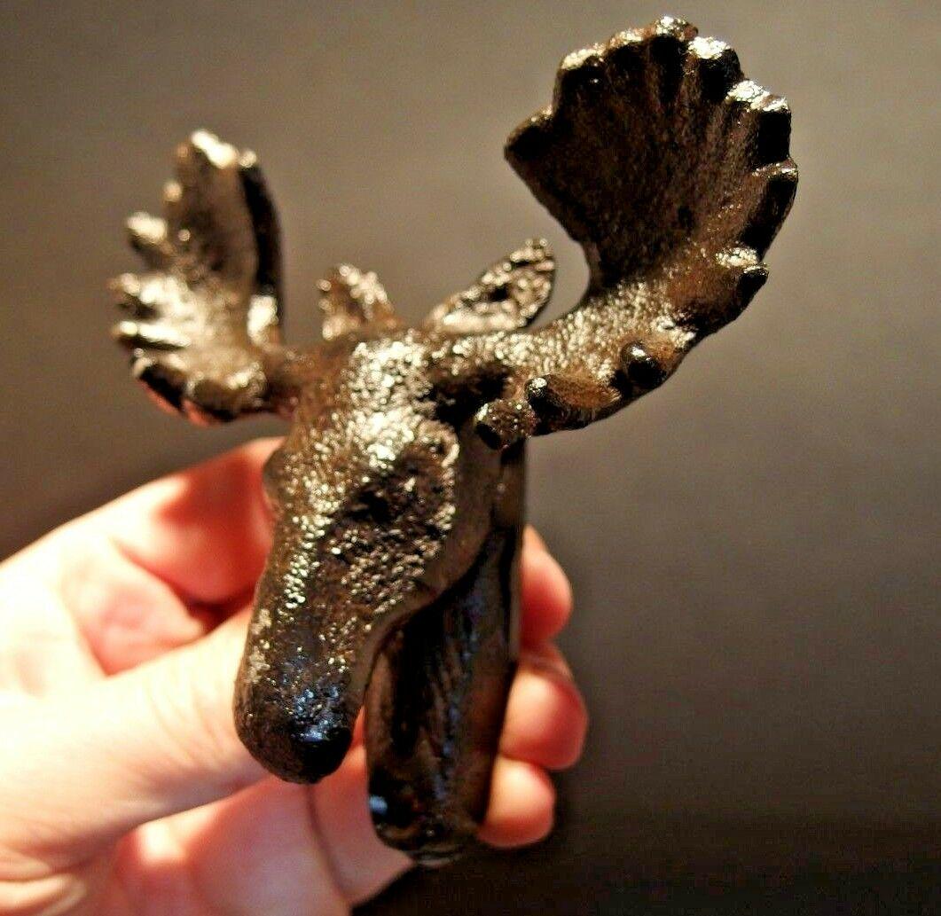 Cast Iron HEAVY Moose Head Wall Mount Beer Bottle: 4 1/4" Wide x 4" Tall x 1 1/2" Extension Great reproduction cast iron bottle opener. This piece was made to look just like an antique, but is new. Reserve: $10.00 Shipping: Domestic: Flat-rate of $8.0