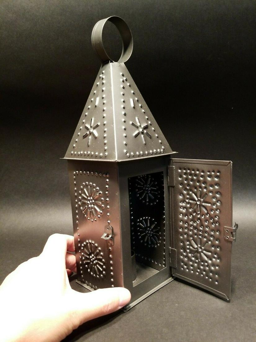 Punched Tin Iron Candle Lamp: 12 1/4" Tall with hanging ring x 3 5/8" Wide Nice Replica 19th C tin colonial candle lantern with punched tin designs. Made and aged to look just like an original antique. Reserve: $20.00 Shipping: Do