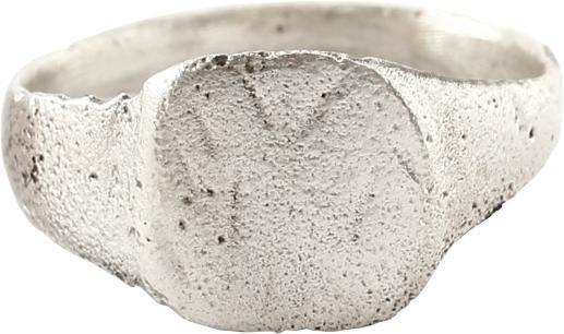 MEDIEVAL EUROPEAN RING C.7TH-10TH CENTURY AD: Silvered bronze, size 6 ½. 2.6mm rounded face band flaring to the shoulders and the rounded square bezel which is incised with hatch marks flanking a pair of parallels. Formed as a signet ring, it mo