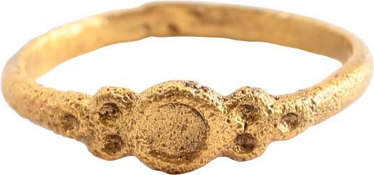 MEDIEVAL EUROPEAN GIRL’S’S RING. C.1400-1500. SIZE 2 ¼: Small size 2 1/4 , 1.6mm width. The form as a betrothal ring with raised edge center ring flanked by triple circles. Formal betrothals were celebrated with the exchange of rings and betrothal of child