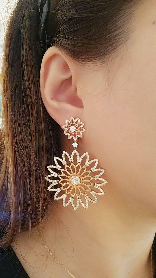 4.69 ct Diamond Cutout Flower Earrings in 18k Rose Gold: CRIVELLI Diamond Cutout Flower Earrings in 18k Rose Gold Italian Maker CRIVELLI Flower-shaped Cutout Earrings in 18k Rose Gold featuring 4.69 ct Total Diamond Weight Diamonds are pave set with quality
