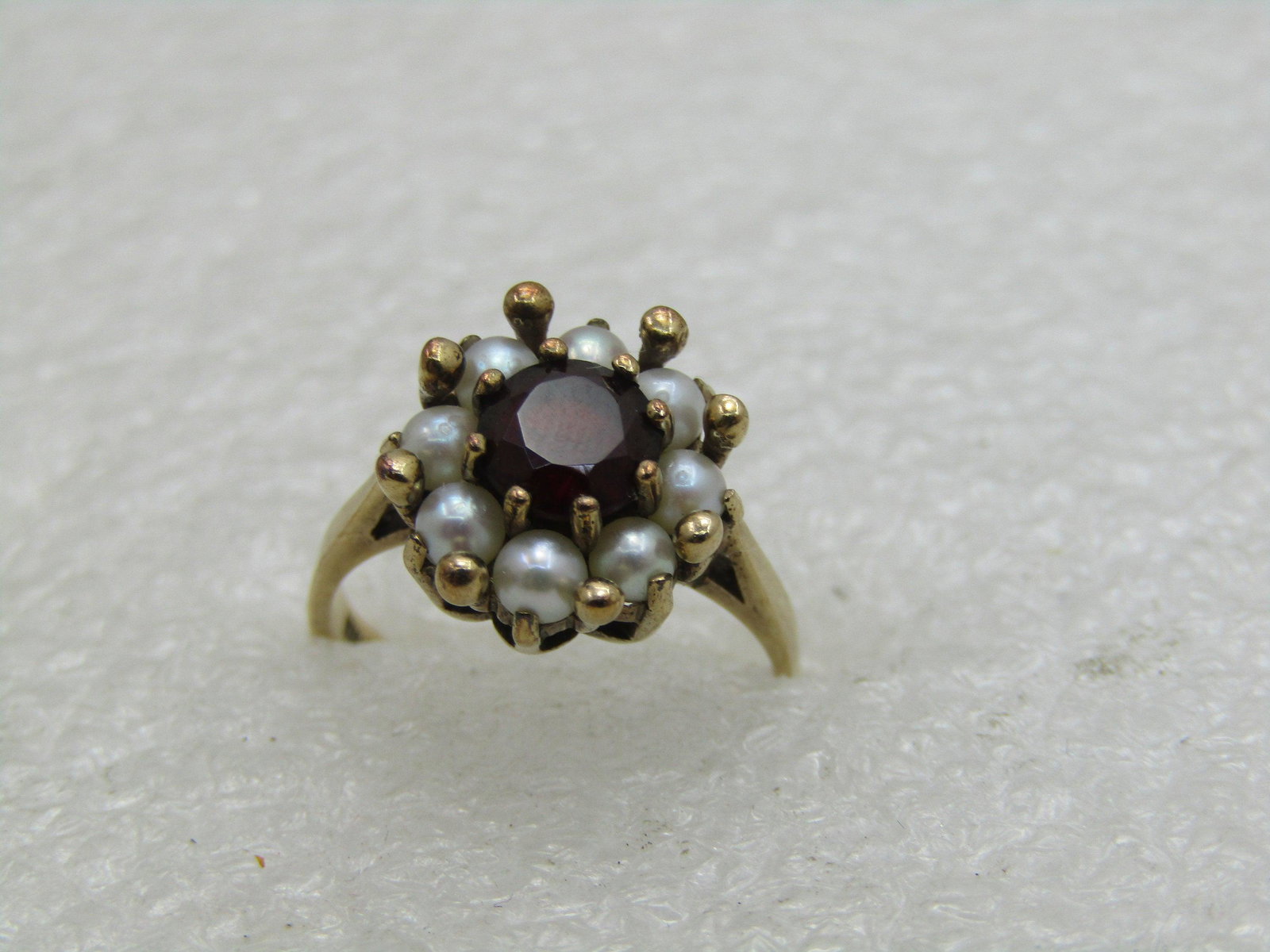 Vintage 10kt Ruby Tourmaline & Pearl Halo Ring, Sz.: Vintage 10kt Ruby Tourmaline & Pearl Halo Ring. Size 5.75. Appx. 4.3 ctw tourmaline (with an older cut with a shorter table) and 8 pearls that are appx. 2.5mm. Natural pearls. Set in a raised prong-se