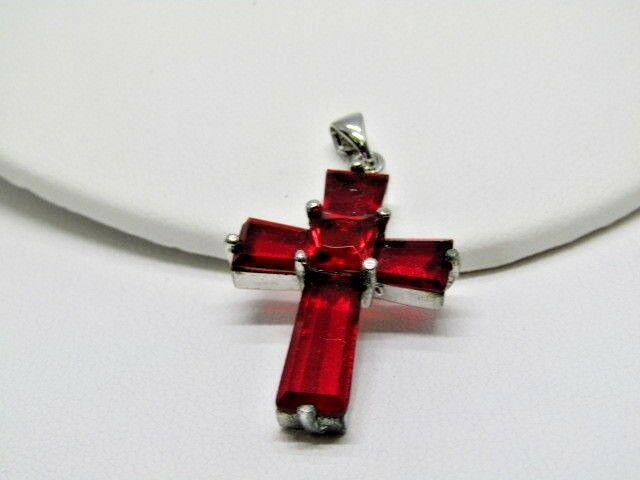 Red Rhinestone Rhinestone Cross Pendant, Silver Tone,: Red Rhinestone Cross Pendant - 1.75" long and 7/8" wide. It has a square red rhinestone at the intersection of the cross that is raised. Stones are prong set. Swing bail. It is marked 18kt E.P. It is 