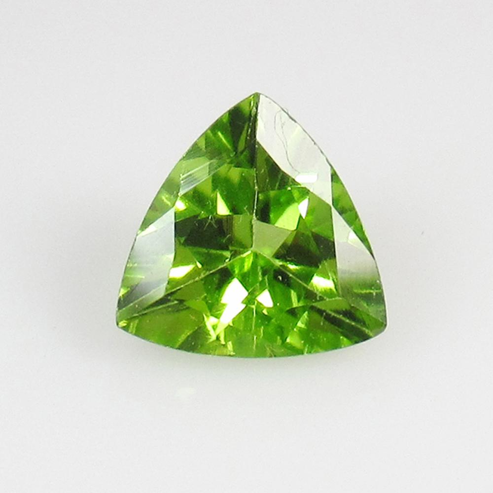 0.99 Ctw Natural Pakistan Peridot Trillion Cut: No Reserve! Title: 0.99 Ctw Natural Pakistan Peridot Trillion Cut Stone Clarity: VVS Gemstone:Peridot Carat Weight: 0.90 Size/Dimension: 7.00 x 7.00 x 3.30 mm Additional Info: Top Class Luster / Excel