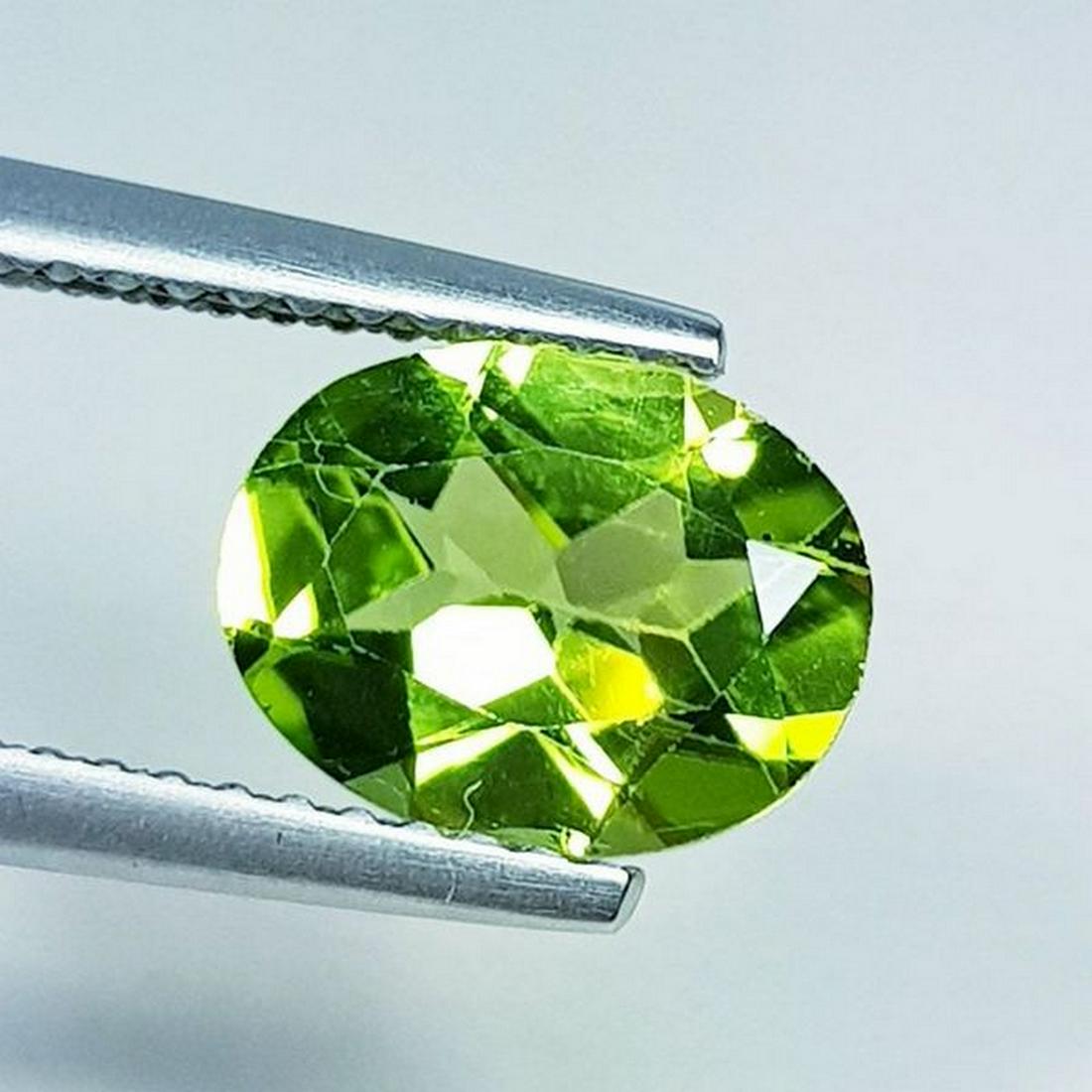 Natural Peridot Oval Cut 1.70 ct: No Reserve! Title: Natural Peridot Oval Cut 1.70 ct Color/Clarity: VVS Gemstones: Loosegemstone Carat Weights: 1.7 Size/Dimensions: 9.00 x 7.00 x 4.00 Additional Information: Oval - Pakistan Shipping: