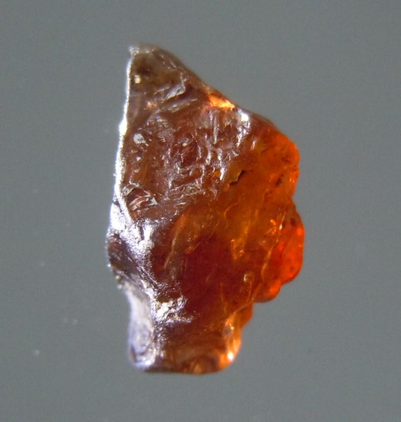 0.7 CT TRANSLUCENT ZIRCON - UNTREATED GEMSTONE: No Reserve! Title: 0.7 CT TRANSLUCENT ZIRCON - UNTREATED GEMSTONE Origin: Baw Gaew, Ratanakiri, Cambodia Size: 0.66x0.36x0.23 cm / 0.14 gram Description: purple-red, translucent, glittering zircon Shi