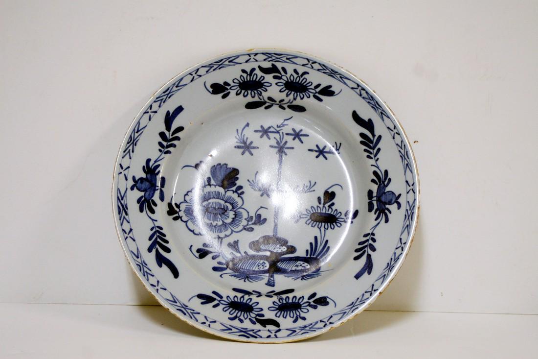 A mid 18th century Bristol delft plate decorated (1 of 2)