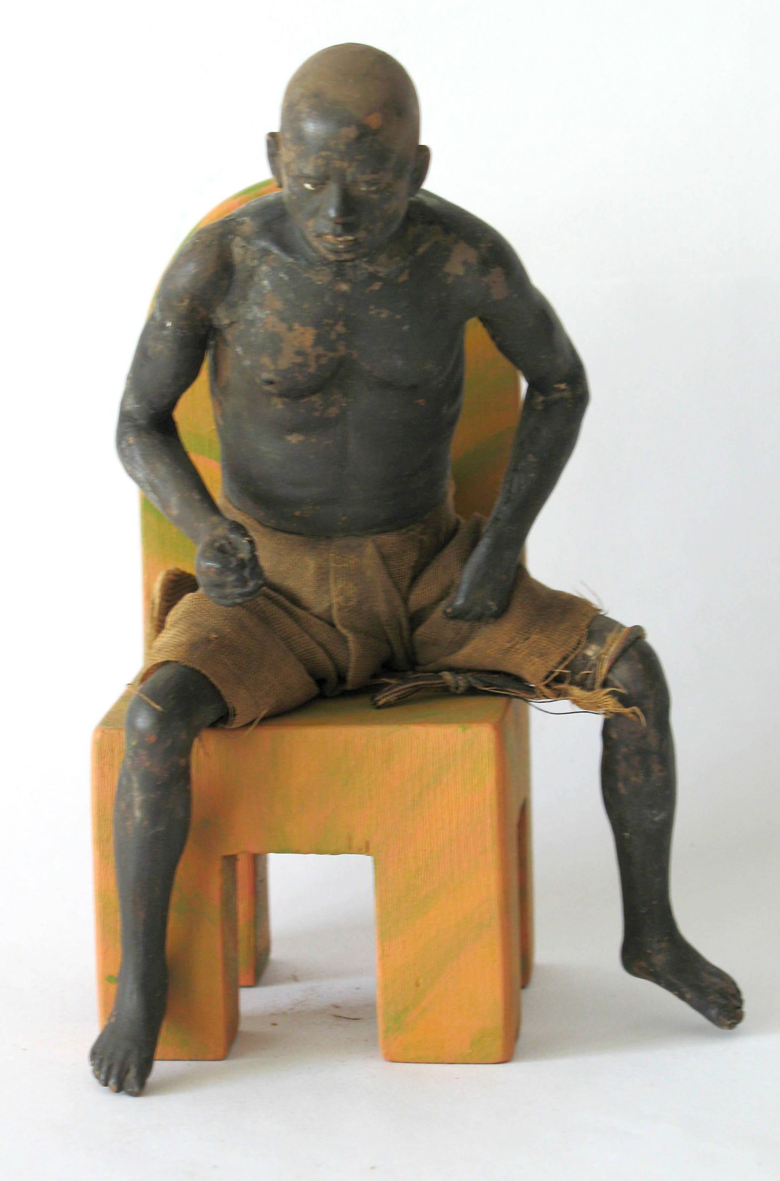 Interesting black man on a chair. (1 of 2)