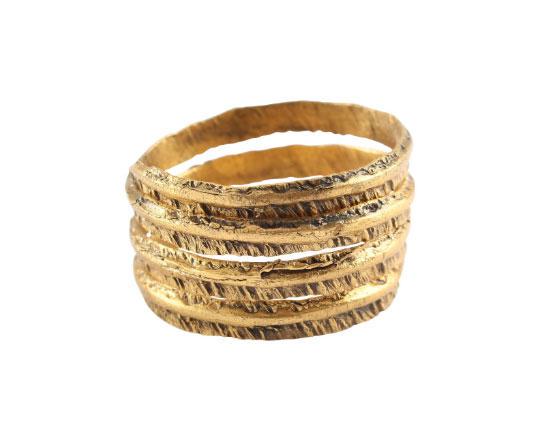 ANCIENT VIKING COIL RING 850-1050 AD SIZE 10 ¾.: Size 10 ¾ 3 ½ coils to 12.4mm, just under ½” width. Broad section with an offset half rounded band flanked by flats, broad one side, and narrow the other. The flats hand chiseled in feather motif