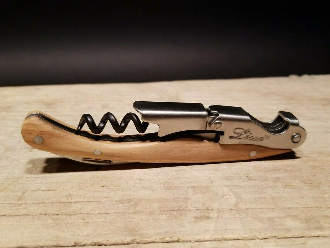 Corkscrew with Olive Wood Handles: 4 3/4" long x 5/8" Wide Nice quality, brand new, never used heavy waiters style corkscrew with olive wood handles. This piece is made from stainless steel and wood. An extra sharp serrated foil cutter