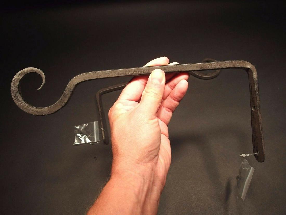 (2) Blacksmith Forged Iron Hook Plant Lantern Hangers: (2) Hooks 5 1/2" Tall.. 11 3/4" Extension 2 Charming and functional sturdy iron wall hand forged to look like antiques. Great textured black powder coat for a sturdy finish. Reserve: $25.00 Shipping: 