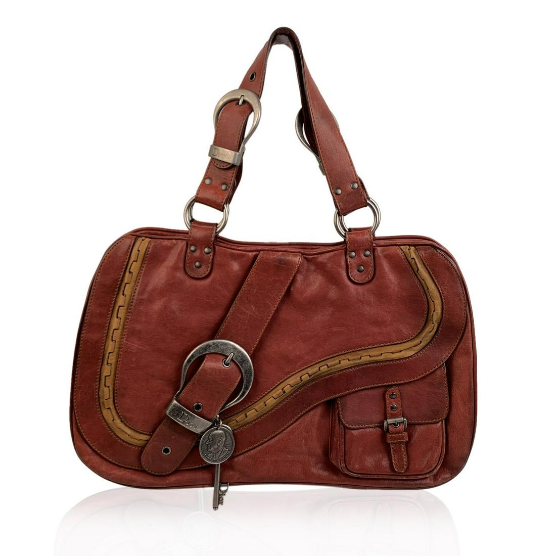 Christian Dior Brown Leather Gaucho Double Saddle Tote: Christian Dior 'Gaucho' Double Saddle bag from the 2006 Spring/Summer collection. Crafted in Brown leather with tan leather trim. It features a front saddle flap with magnetic closure and a front zip