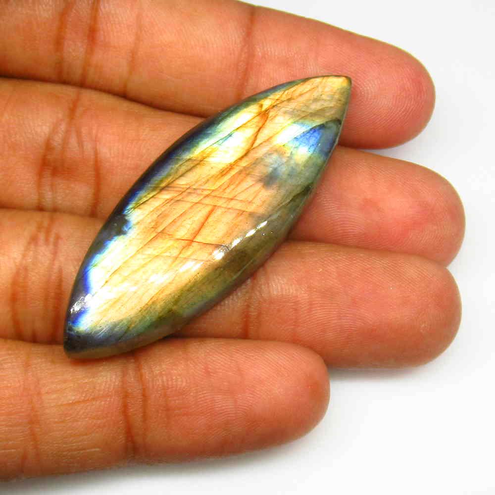 64.09 Ct Natural Labradorite Marquise Cab: Title: 64.09 Ct Natural Labradorite Marquise Cab Stone Clarity: Opaque Gemstones: Natural Labradorite Carat Weights: 64.09 Size/Dimensions: 51.00 x 18.40 x 8.20 mm Additional Information: Nice Marquis