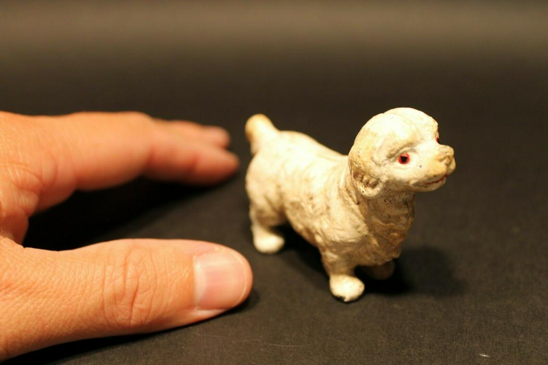 Miniature Cast Iron Prince Charles Spaniel Dog: 3" Long 2" Tall Great little reproduction cast iron prince Charles spaniel. All cast iron hand painted, slightly distress as shown in the images. Certainly looks old! See our other miniature cast iron