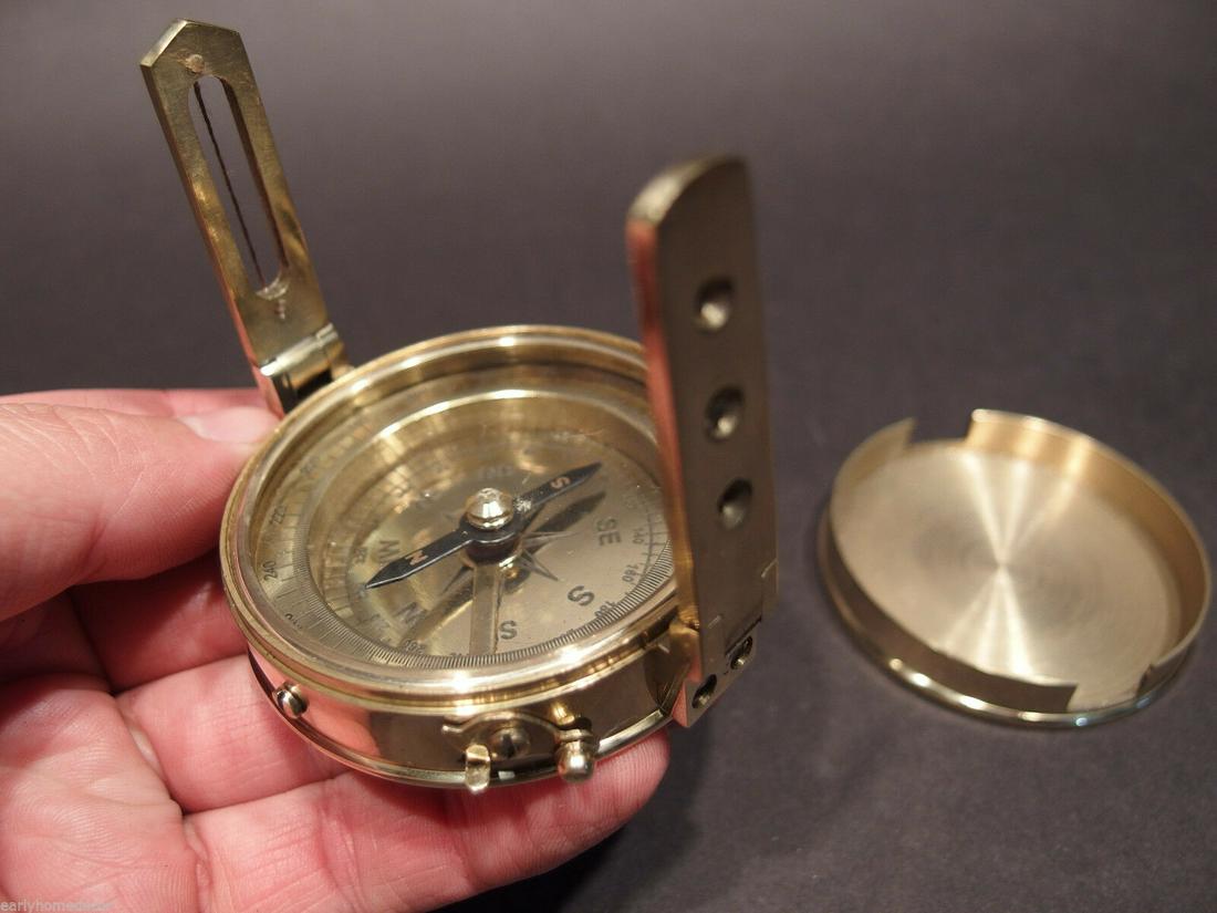 Brass Surveyors Compass: 3" at its widest 2 3/8" High With the arms up Nice fully functional reproduction of an antique surveyors compass. Be sure to use the focus option with the pictures to see the details such as the compa