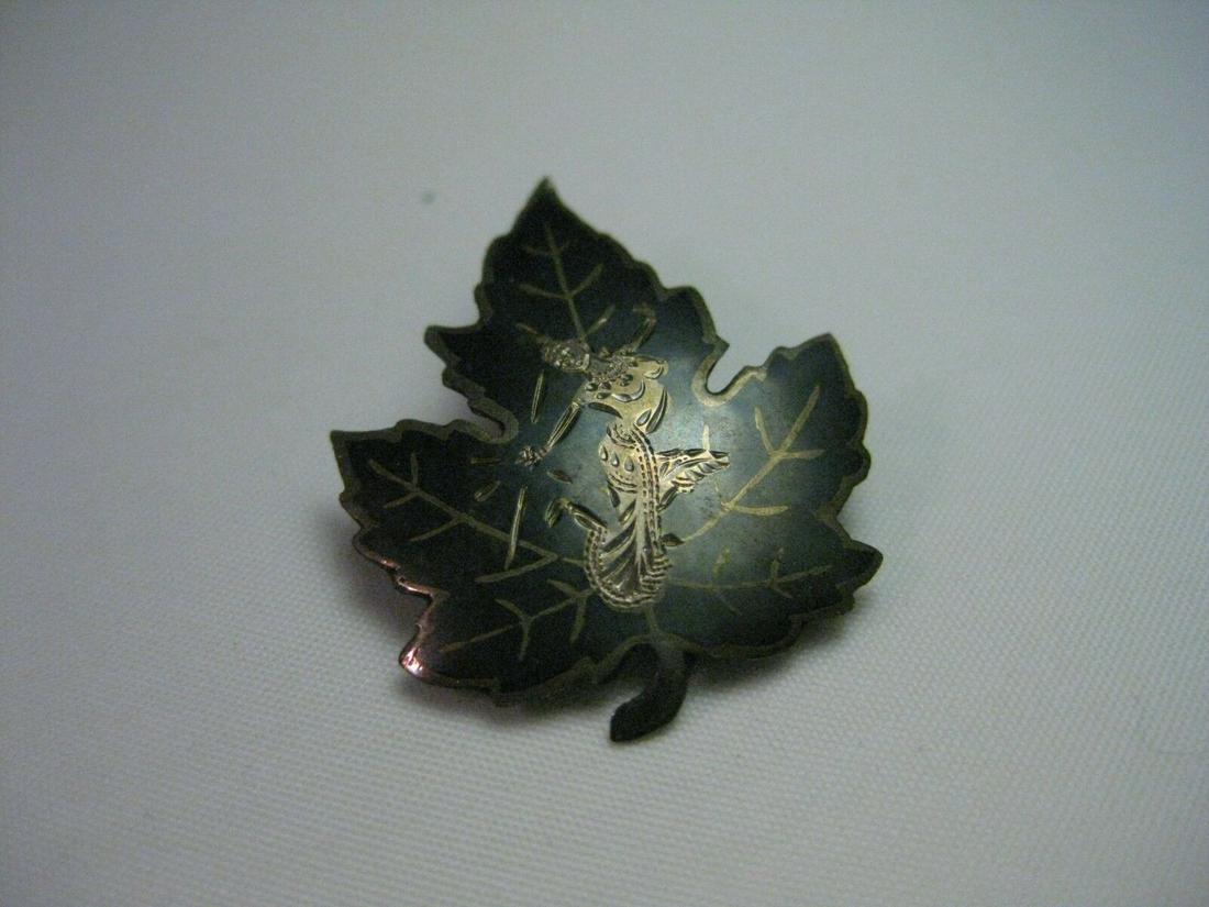 True Vintage Sterling Silver Siam Maple Leaf with: Vintage Siam signed 1.25" black enameled with Siam figure on maple leaf shape brooch that is 1" wide and weighs appx. 3 grams. It has some light wear/patina. Will clean easily however I do not clean v