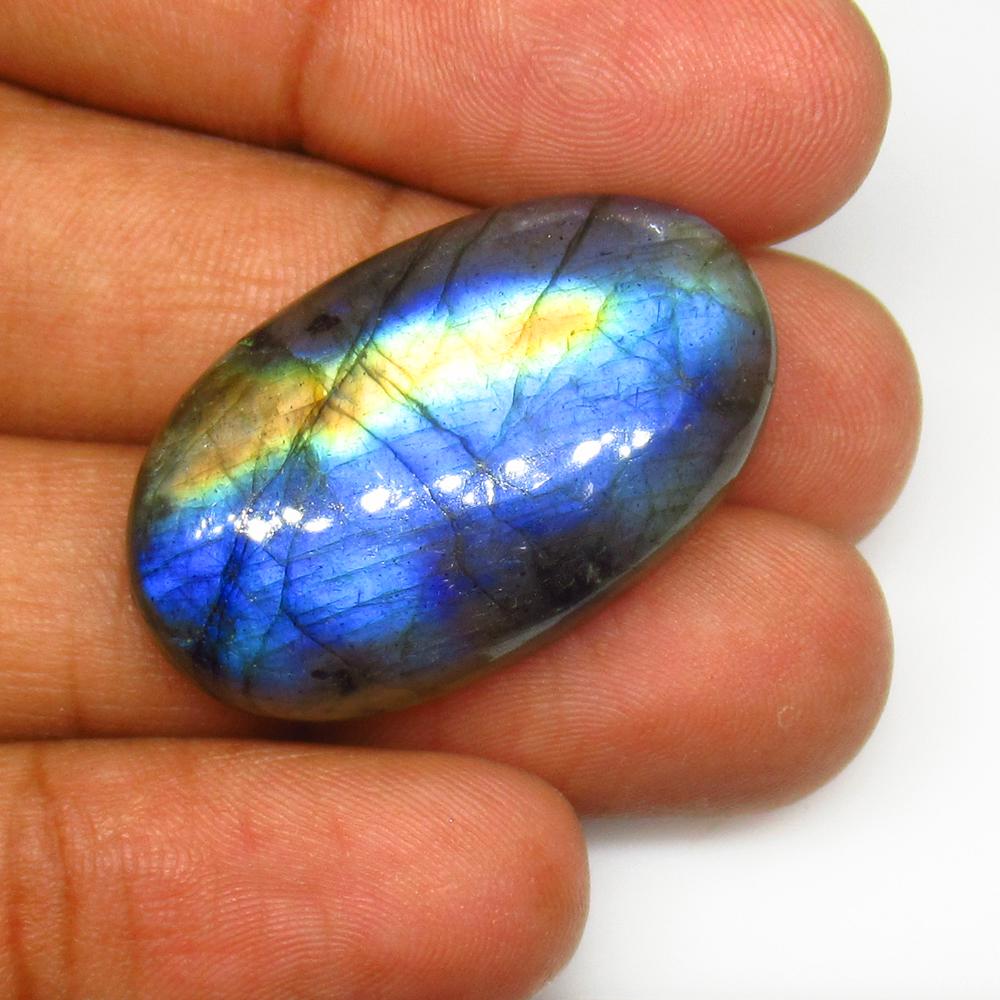 41.08 Ct Natural Labradorite Oval Cab: No Reserve! Title: 41.08 Ct Natural Labradorite Oval Cab Stone Clarity: Opaque Gemstones: Natural Labradorite Carat Weights: 41.08 Size/Dimensions:31.00 x 19.00 x 7.60 mm Additional Info:Nice Oval Cab