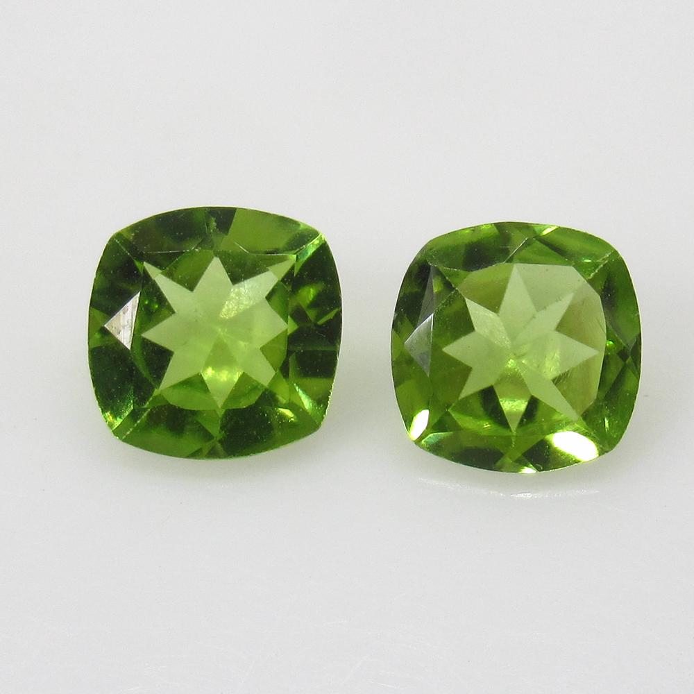 2.42 Ct Natural Pakistan Peridot Cushion Pair: No Reserve! Title: 2.42 Ct Natural Pakistan Peridot Cushion Pair Stone Clarity: VVS Gemstones: Natural Peridot Carat Weights: 2.42 Size/Dimensions:7.00 x 7.00 x 3.50 mm / 2 PC's Additional Info:Top Cl