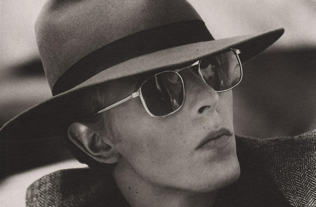 TERRY O’NEILL - David Bowie, The Man who Fell to Earth,: Artist: TERRY O’NEILL Print Title: David Bowie, The Man who Fell to Earth, 1976 Printing Date: 1980’s Medium: photo-lithograph Printed in: Italy Image Size approx.: 4.5 x 6.5” Terry O'Neill ((bo