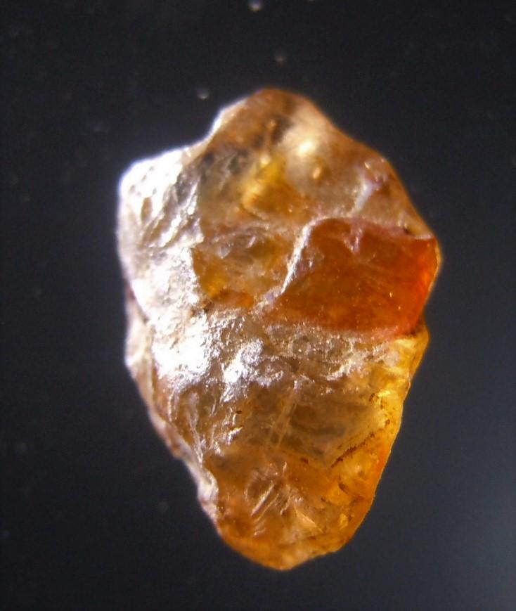 1.1 CT GOLDEN BROWN ZIRCON - UNTREATED GEMSTONE: No Reserve! Title: 1.1 CT GOLDEN BROWN ZIRCON - UNTREATED GEMSTONE Origin: Baw Gaew, Ratanakiri, Cambodia Size: 0.63x0.45x0.3 cm / 0.22 gram Description: golden brown zircon with crystalline faces Shi