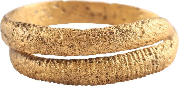 FINE VIKING COIL RING, 10th CENTURY AD SIZE 11 1/4: Size 11 1/4. Gilt bronze. Size 11 1/4. Rounded face band in 1 1/2 coils to over 1/4” width. Textured from burial. Sound wearable condition and professionally refurbished with the 24karat gold surfac