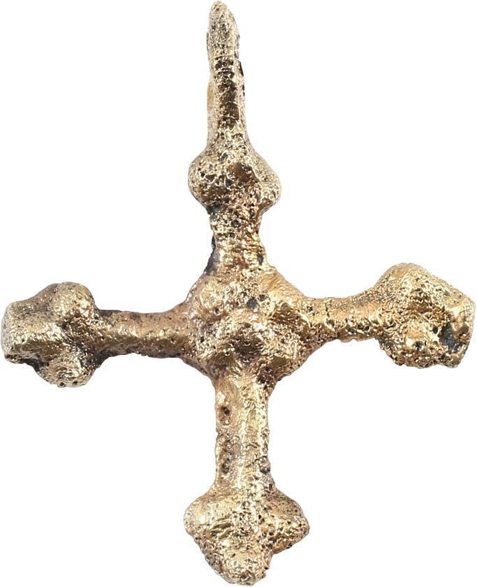 FINE MEDIEVAL SAXON CONVERT’S CROSS C.800-1000 AD: Gilt bronze. Elegant form, slightly over 1” height, with trefoil beam terminals. The junction of the beams with a saltire both sides. The emergence from the Dark Ages is embodied in the rise to powe