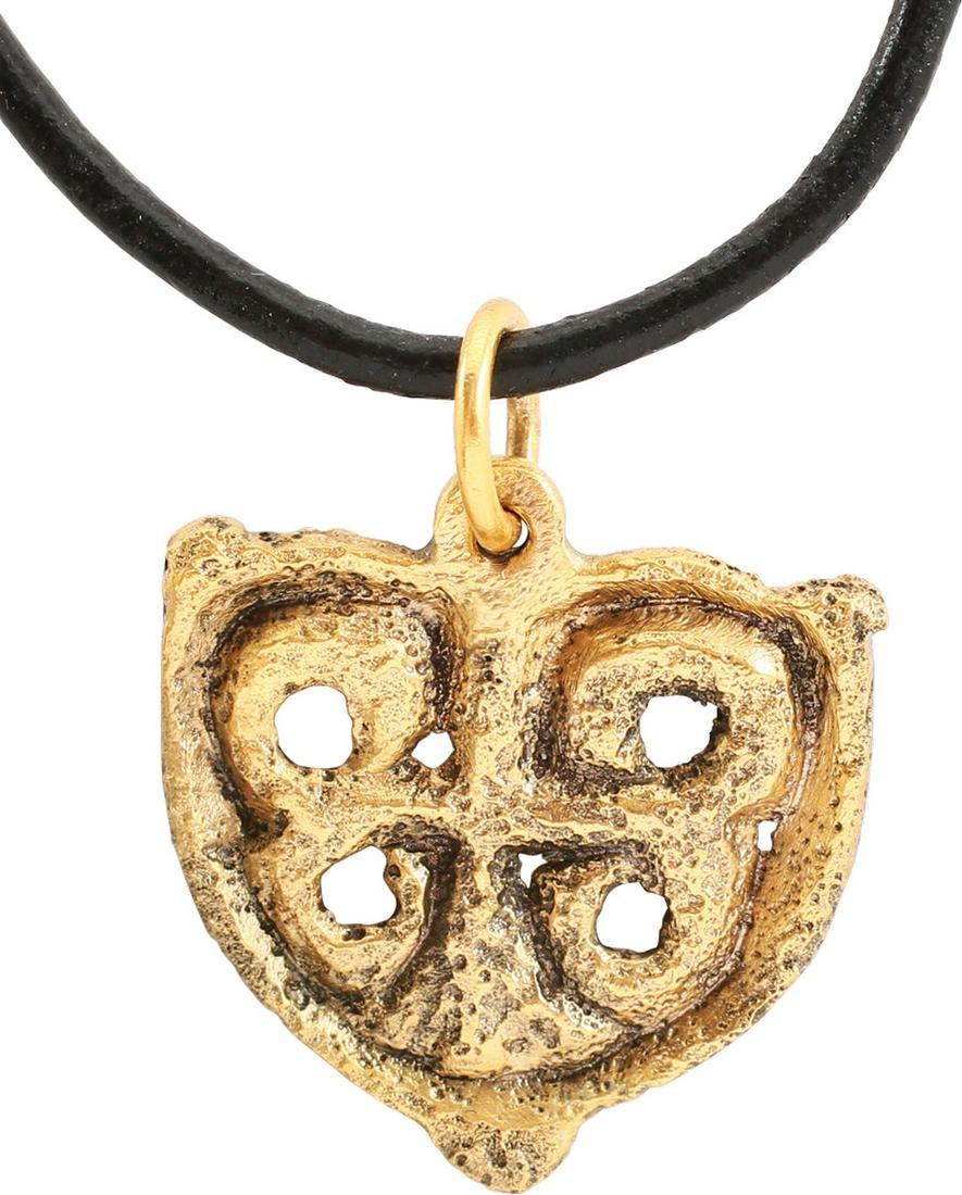 MEDIEVAL WARRIOR’S PENDANT NECKLACE 14-15 CENT JEWELRY: Europe, gilt bronze, just over 7/8” width of shield shape with stylized cross decoration. The top recurved in imitation of the bouched shields of the 14th century. These evidently identified the nob