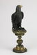 Patinated and gilt bronze sculpture of a bird of prey