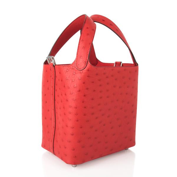 Hermes Picotin Lock 18 Bag Rouge Exotique Ostrich Tote: Guaranteed authentic Hermes Picotin Lock 18cm features vivid red Rouge Exotique Ostrich tote bag. Fresh with palladium hardware. This roomy small tote is a perfect go to bag! Comes with lock and keys,