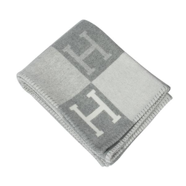 Hermes Avalon III Signature H Gris Clair and Ecru Throw: Guaranteed authentic Hermes classic Avalon III signature H blanket features Gris Clair and Ecru. Created from 90% Merino Wool and 10% cashmere and has whip stitch edges. Comes with Hermes box. New or 