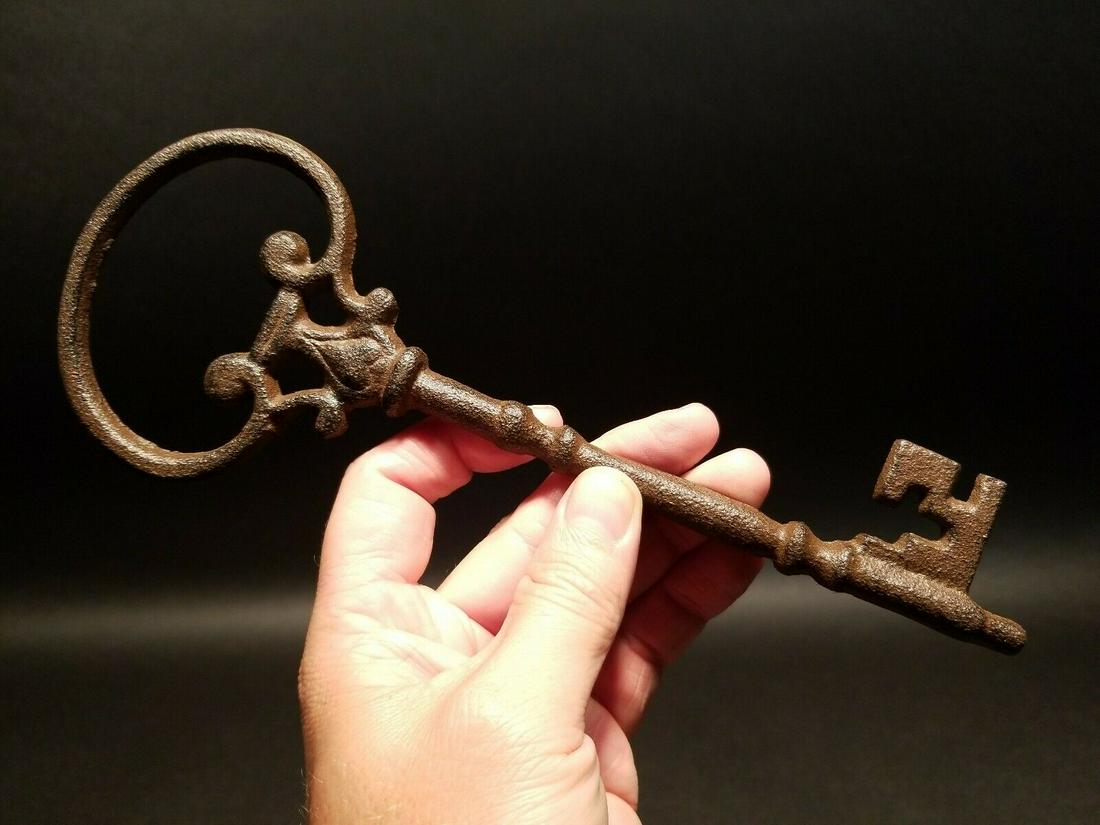 Cast Iron Large Skeleton Key: 9 1/2" Long 3 1/2" Wide Such a wonderful reproduction antique cast iron key! As you can see this key has a somewhat ornate shape. The entire piece is cast iron in a antique gun metal gray finish. Rese