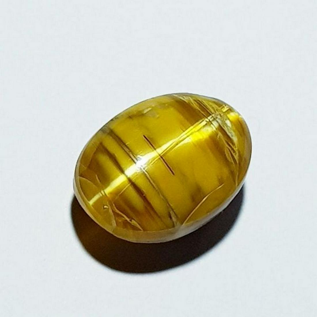 11.46 ct Natural Opal Cat's Eye: No Reserve! Title: 11.46 ct Natural Opal Cat's Eye Color/Clarity: Semi Transparent Type: Loosegemstone Carat Weight: 11.46 Dimensions: 15.40 x 11.70 x 11.00 Additional Information: Oval - Africa Shipp