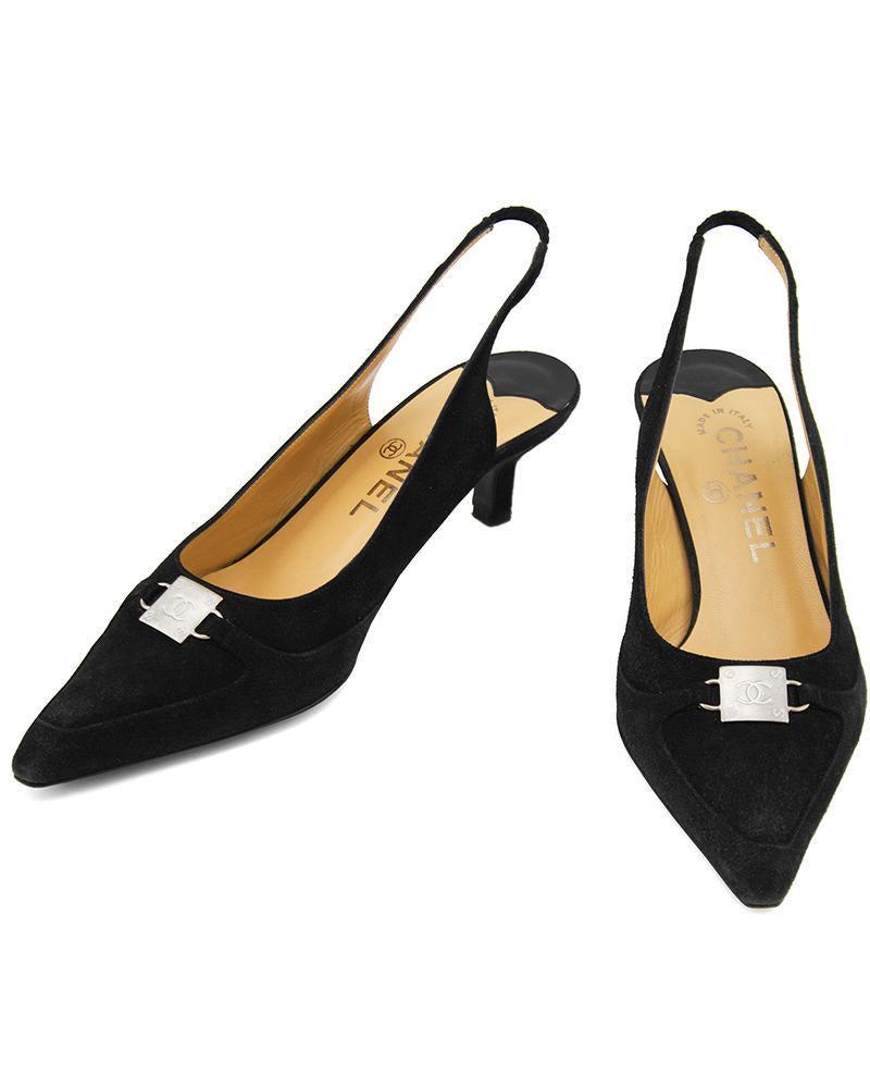 Chanel Black Suede Pointed Toe Sling Back Kitten Heels: Late 1990s Chanel black suede kitten heel sling backs with a pointed toe box. The shoes are accented with a silver square CC buckle on the bridge with faux nail detail. In excellent condition, light t