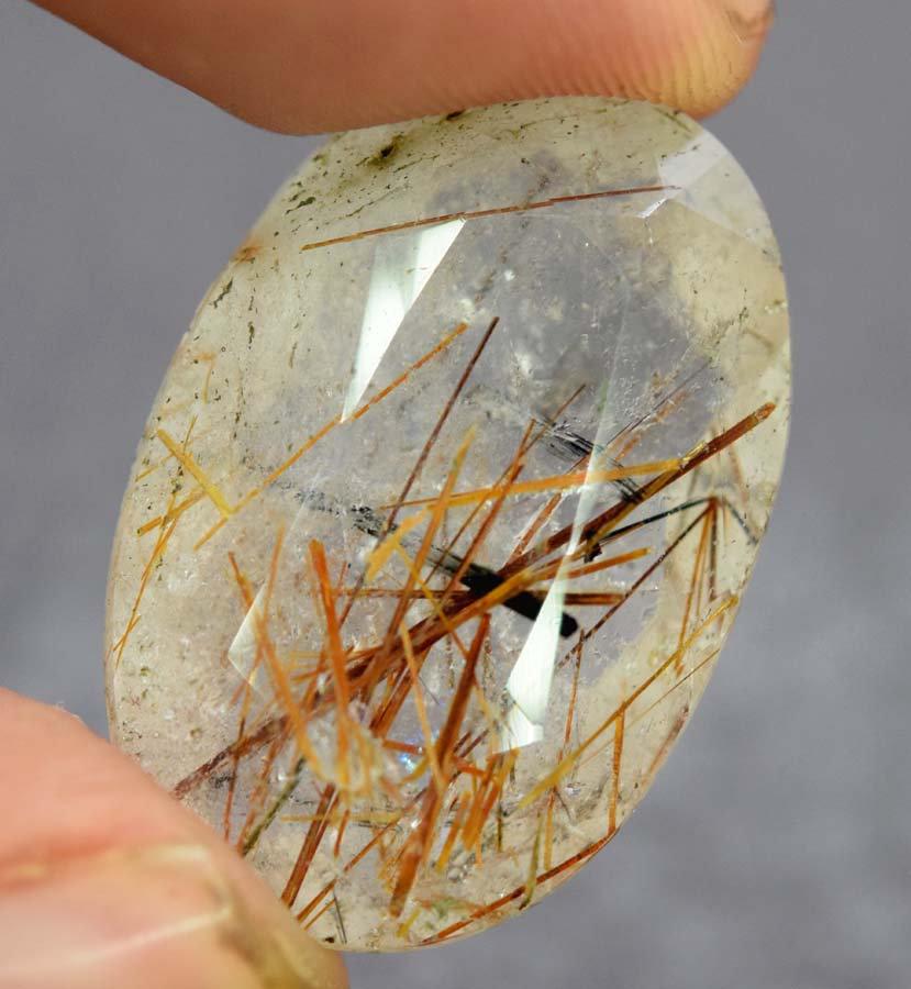 Rutile Quartz , Natural Rutile Quartz Gemstone - 20.40: Materials Rutile, Quartz, Gemstone more Dimensions Carat weight: 20.40 Description Rutile Quartz , Natural Rutile Quartz Gemstone - Weight : 20.40 Carat Size : 24*16*8 mm Origin : Pakistan Treatment :