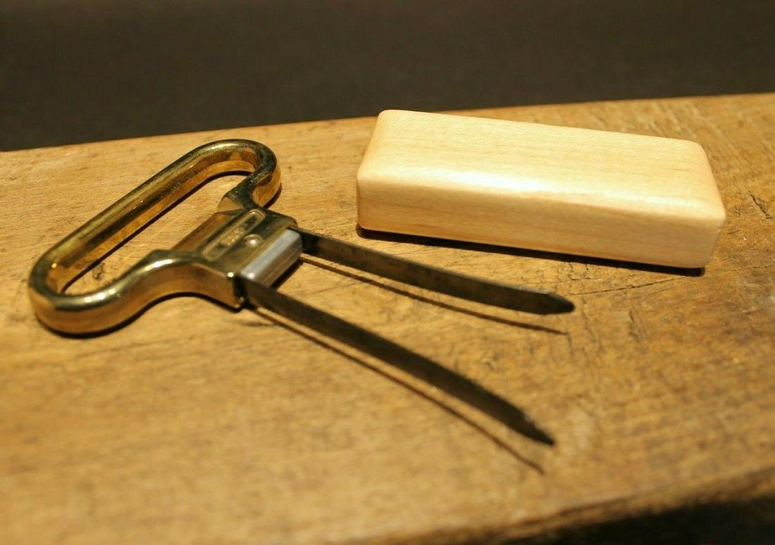Two Prong Cork Puller Corkscrew Wine Opener w Wood: 4 1/5" Long x 2 1/2" Wide.. Wonderful two prong cork puller with a birch wood sheath. Made in Italy. Reserve: $10.00 Shipping: Domestic: Flat-rate of$6.00 to anywhere within the contiguous U.S. Intern