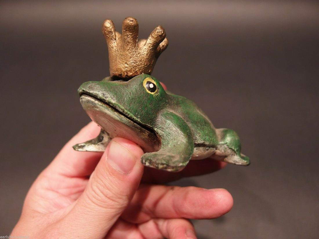Folk Art Beer Soda Bottle Cap Frog Opener: 3 3/4" Long x 2 3/4" Wide x 2 1/4" Tall Great folk art cast iron bottle opener. This piece was hand painted and aged to look like an antique. Reserve: $15.00 Shipping: Domestic: Flat-rate of$7.00 to a