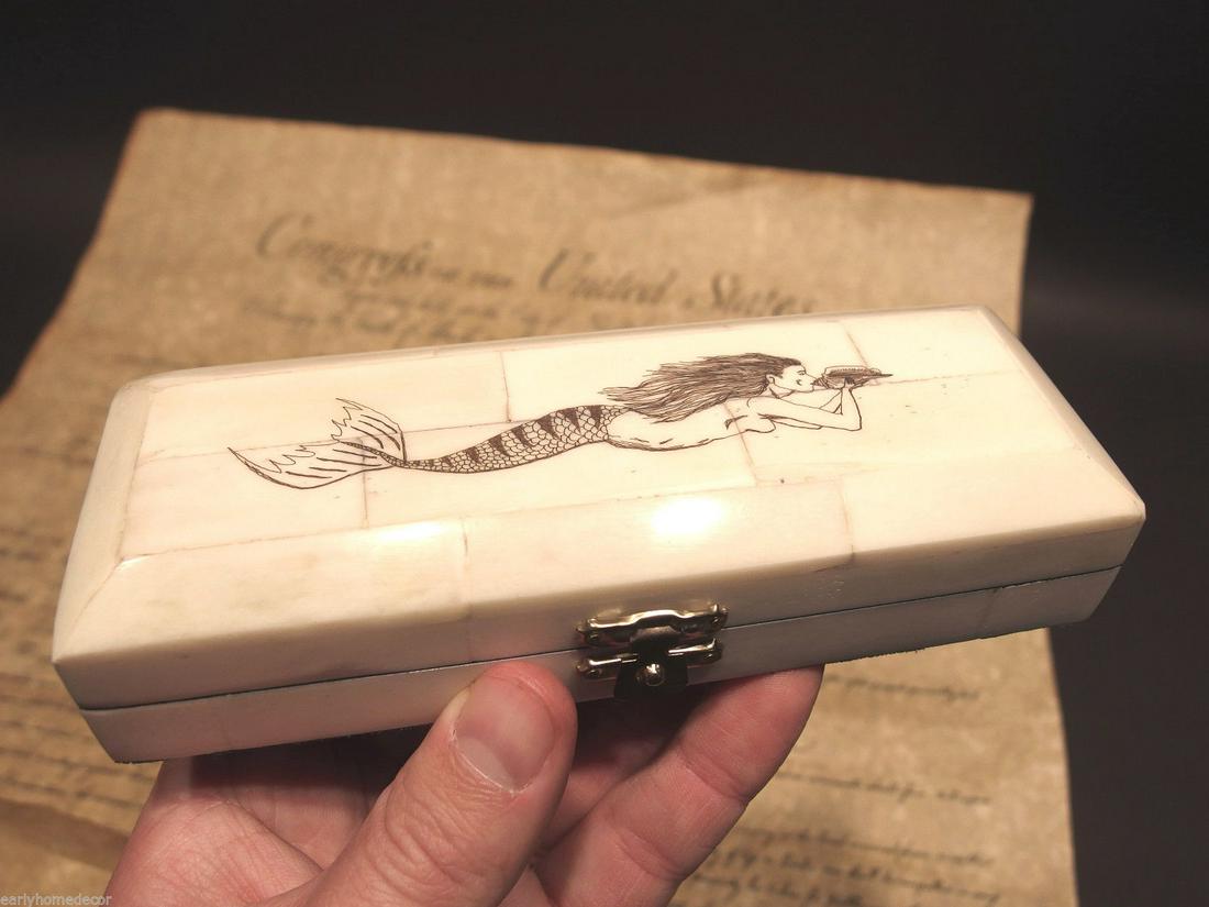 Mermaid Scrimshaw Etched Bone & Wood Trinket Stamp: Antique Style Folk Art Mermaid Scrimshaw Bone & Wood Trinket Stamp Jewelry Box Description 6 1/4" Long x 2 1/4" Wide x 1 3/8" High Wonderful new reproduction scrimshaw carved ox bone box. As you can s