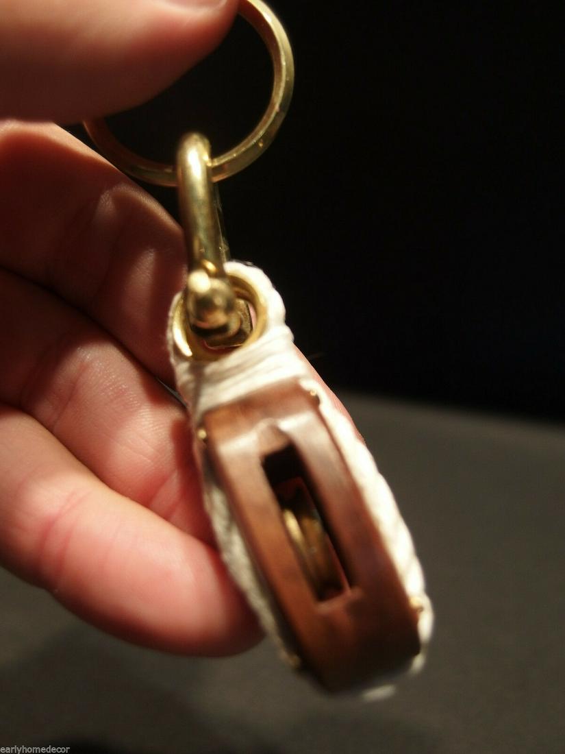 Wood Brass Nautical Sailing Pulley Boat Ship Keychain: 4" long x 1" Wide Well made heavy solid brass and wood keychain. Reserve: $6.00 Shipping: Domestic: Flat-rate of$6.00 to anywhere within the contiguous U.S. International: Foreign shipping rates are d