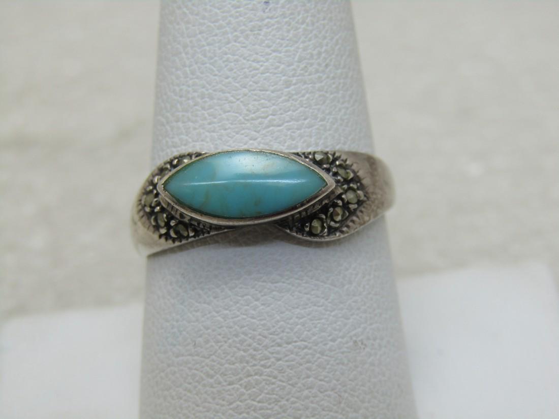 Vintage Southwestern Sterling Turquoise Marcasite Ring,: Vintage Southwestern Sterling Turquoise Marcasite Ring, Size 9, cat-eye shaped turquoise set on it's side on top of the ring, raised bezel-setting with marcasite accents on each point. The band isi ap