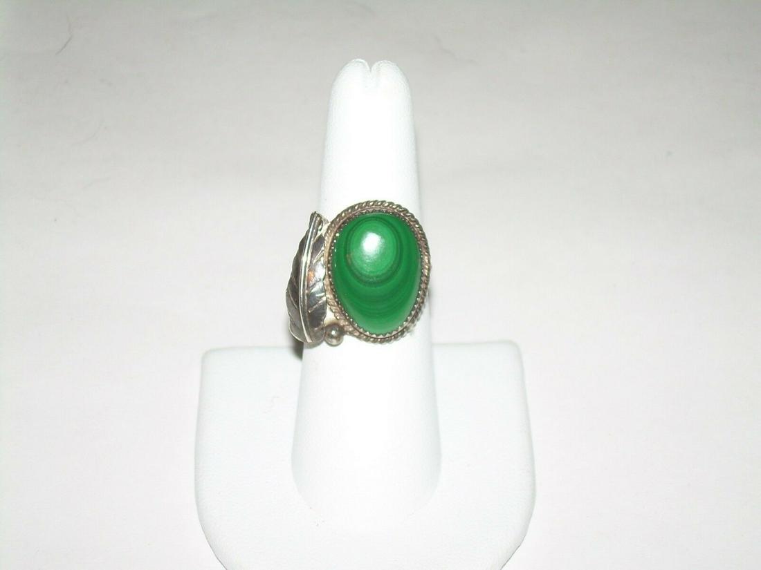 Sterling Southwestern Malachite Feather Ring - Vintage: Vintage southwestern sterling silver malachite feather ring. The stone is raised and bezel set with a feather accenting the side of the ring. The ring was part of a lot that was tested for sterling. R