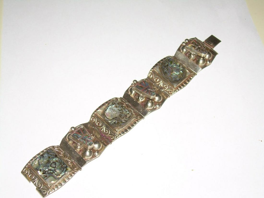 Vintage Carved Abalone Bracelet - Mid - Century Mexican: Gorgeous vintage Mexican sterling silver carved Abalone link bracelet comes with a push clasp. The bracelet measures approximately 7". This vintage piece is from the 1950's. The bracelet comes with 6