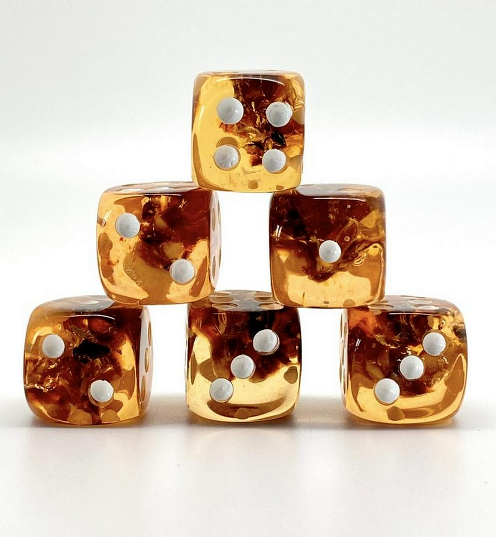 Unique and Beautiful Amber Set of 6 Dices: Title: Unique and Beautiful Amber Set of 6 Dices Metal: None Gemstone: Amber Weight: 31.5 g Size: Size: 17.0 x 17.0 x 17.0 mm Size: 0.669 x 0.669 x 0.669 inches Made of: Reconstituted Amber Additional