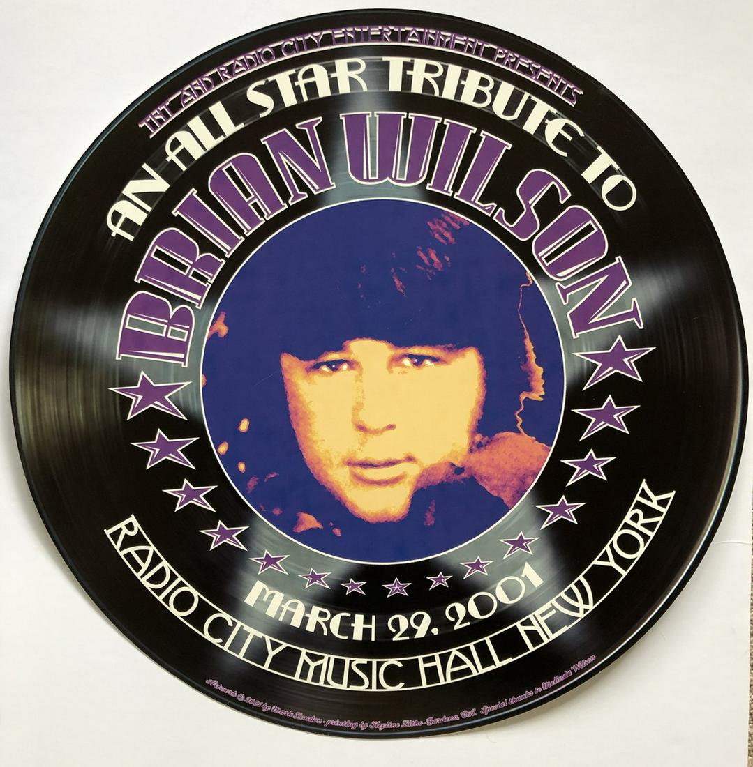 ALL-STAR TRIBUTE TO BRIAN WILSON: ALL-STAR TRIBUTE TO BRIAN WILSON. Super cool round poster for your record room. Tribute show in 2001 at Radio City Music Hall. Art by Mark London. Reserve: $15.00 Shipping: Domestic: Flat-rate of $15.