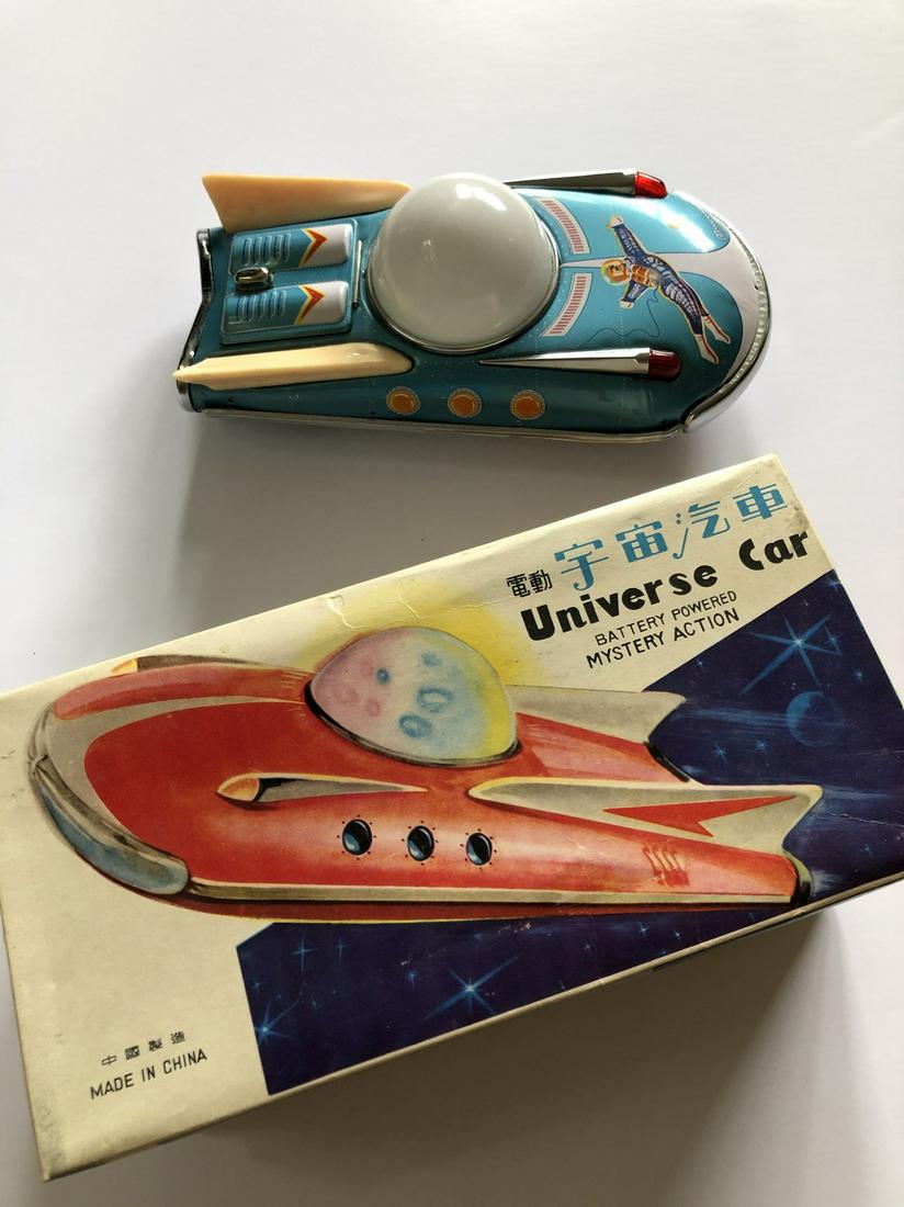 TIN TOY MYSTERY ACTION UNIVERSE CAR: Mint in box. Made in China. TIN TOY MYSTERY ACTION UNIVERS CAR. Battery operated. Battery compartment is flawless. features a multi-color light up dome and has a driving/flying action. works. Reserve: