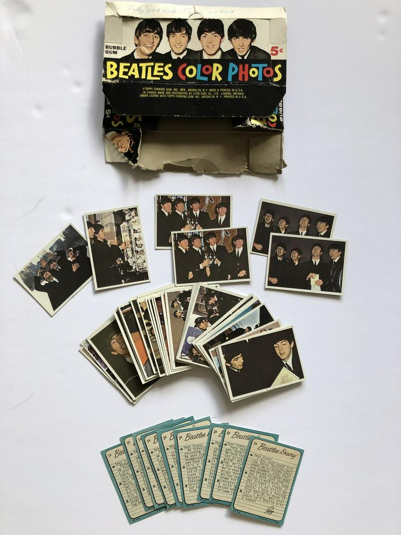 BEATLES DIARY COLLECTOR CARDS: BEATLES DIARYCards #1A-59ASome Dupes Some missing cards56 total cards in near MINT conditionWith Dealer box in poor condition. Reserve: $10.00 Shipping: Domestic: Flat-rate of $12.69 to anywhere withi