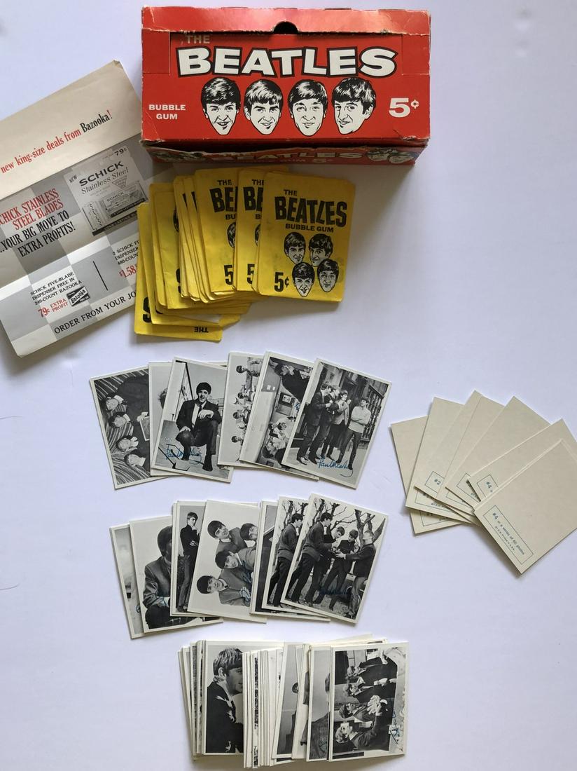BEATLES CARDS: COMPLETE FIRST SET: BEATLES CARDS: COMPLETE FIRST SETFirst Blacks and White SeriesTopps 1964 or soCard #s 1-6081 mint Cards with box in VG condition and original wrappers.Box also has dealer advertising insert.COMPLETE S