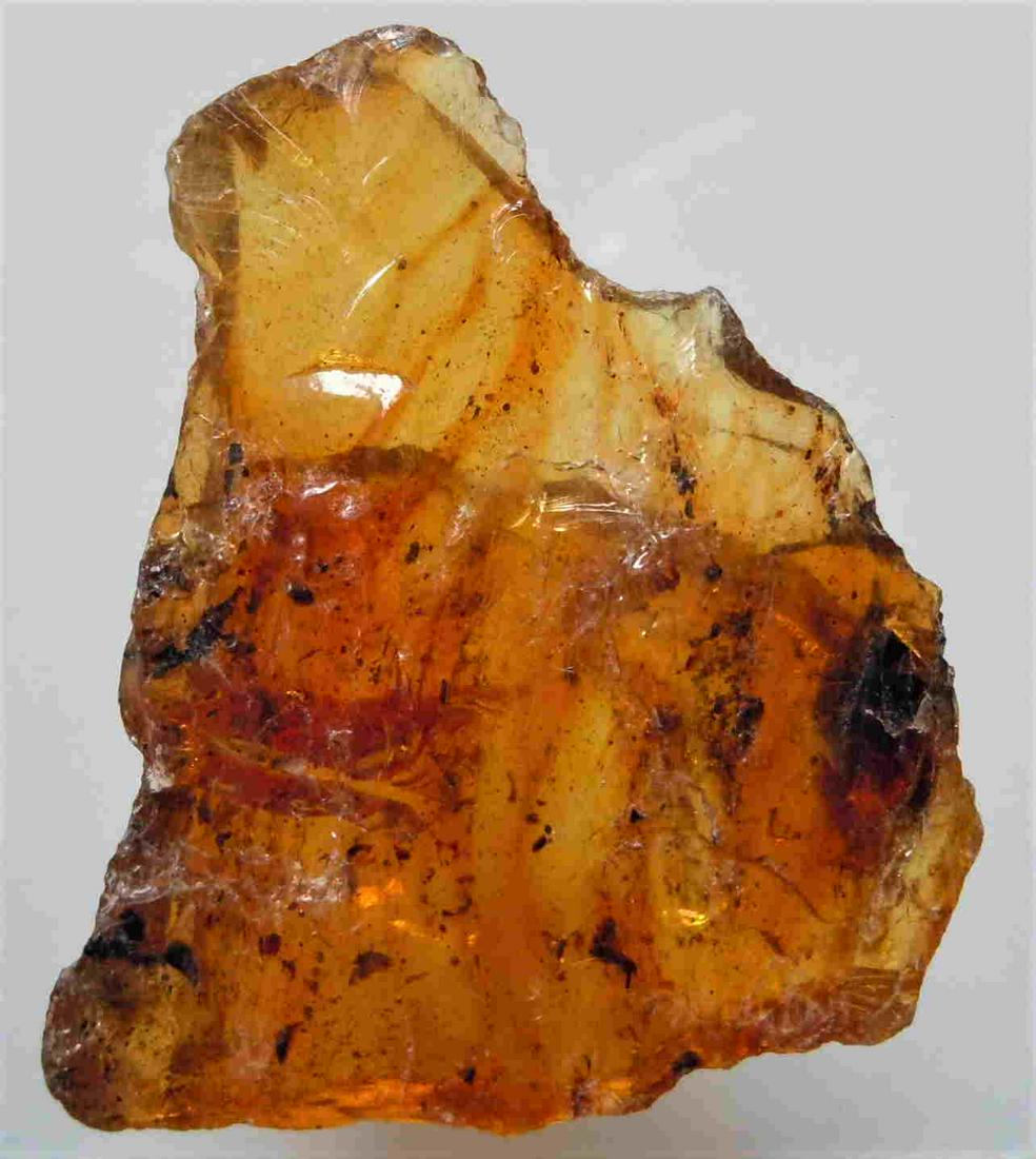 5.82 GRAM 100 MILL YEARS OLD ROUGH BURMITE AMBER: Title: 5.82 GRAM 100 MILL YEARS OLD ROUGH BURMITE AMBER Origin: Hukawang Valley, Kachin State, Myanmar Size: 4.1x3.4x0.7 cm / 5.82 gram Description: yellow to orange rough burmite amber with some incl