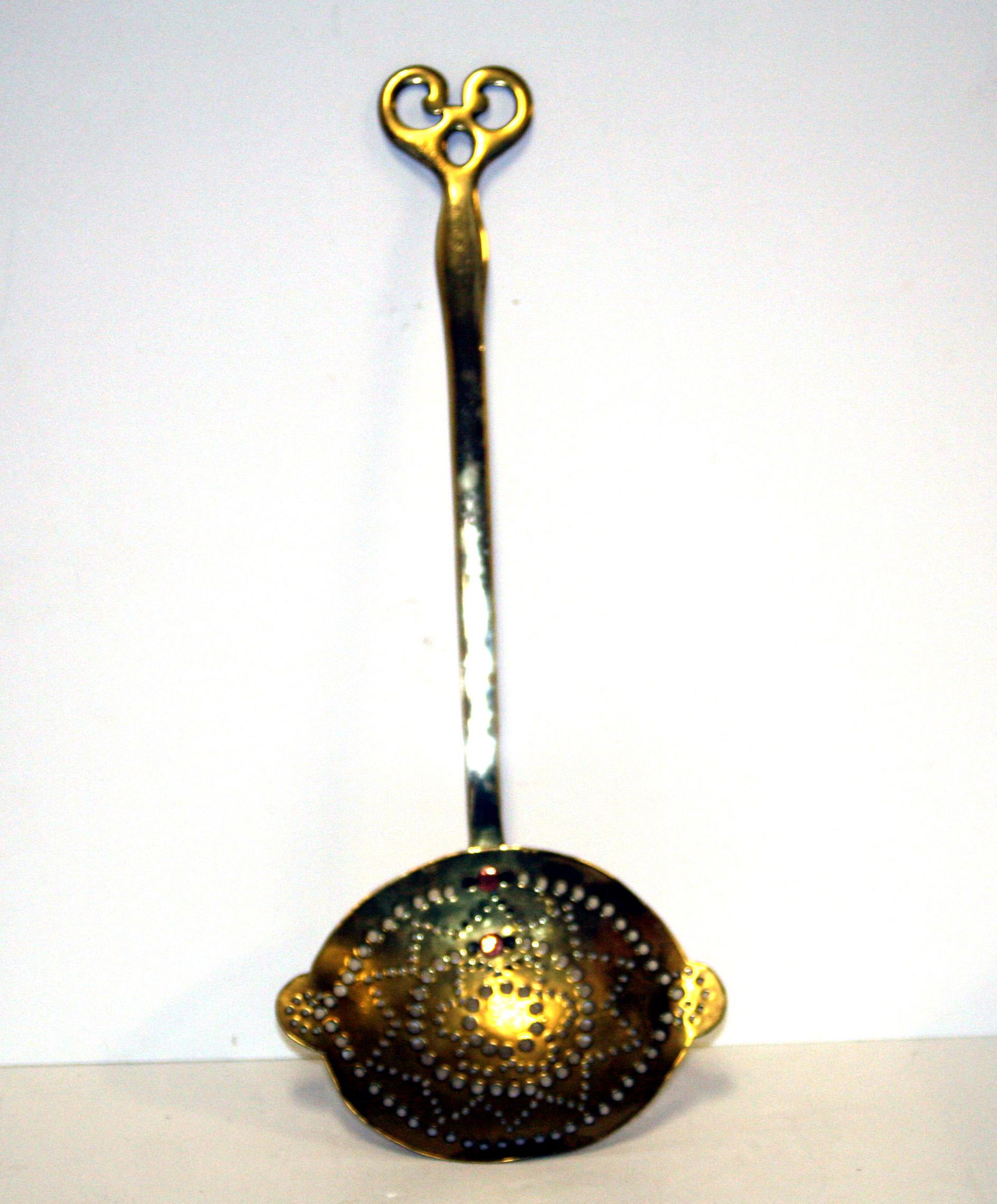 An English early 19th century brass skimmer with (1 of 2)
